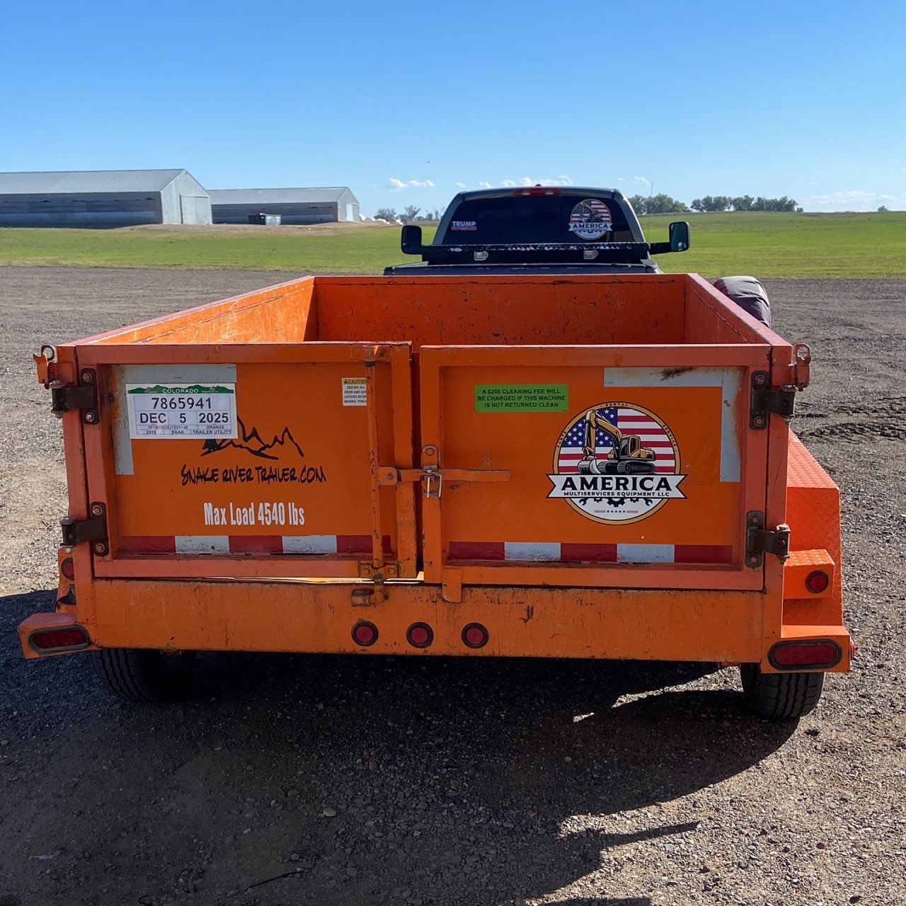 Orange Snake River tandem dump trailer, 4540 lb capacity